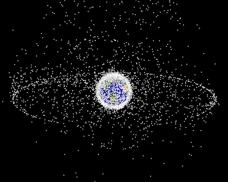 [Computer generated illustraion of objects in Earth orbit that are currently being tracked. Approximately 95% of the objects in this illustration are orbital debris - not functional satellites. Each dot represents the location of an individual piece of (mostly) space trash. The dot sizes are not scaled to Earth. Image credit: NASA. From http://orbitaldebris.jsc.nasa.gov/photogallery/beehives.html]