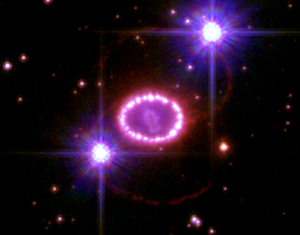 [This image shows the entire region around Supernova 1987A - a core collapse supernova. The most prominent feature in the image is a ring with dozens of bright spots. A shock wave of material unleashed by the stellar blast is slamming into regions along the ring's inner regions, heating them up, and causing them to glow. The ring, about a light-year across, was probably shed by the star about 20,000 years before it exploded. Image credit: NASA, ESA, P. Challis, and R. Kirshner (Harvard-Smithsonian Center for Astrophysics). From http://hubblesite.org/newscenter/archive/releases/2007/10/image/a/]